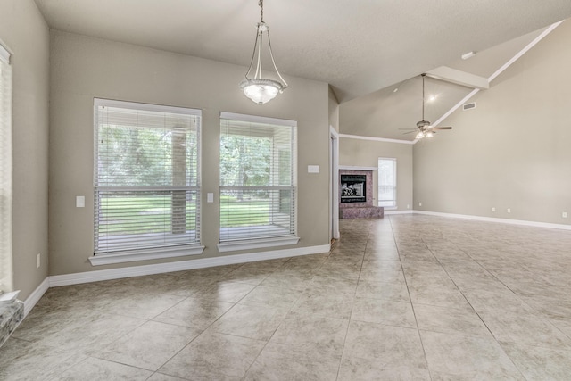 unfurnished living room with light tile patterned floors, ceiling fan, and lofted ceiling