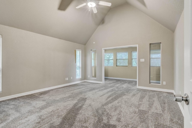 unfurnished room featuring ceiling fan, light carpet, and high vaulted ceiling