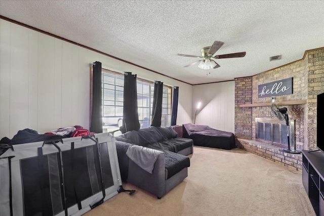 carpeted living room featuring crown molding, a brick fireplace, visible vents, and a textured ceiling