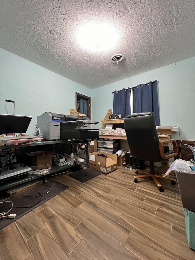 office space with a textured ceiling