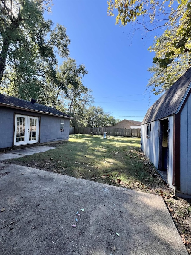 view of yard featuring french doors and a patio area