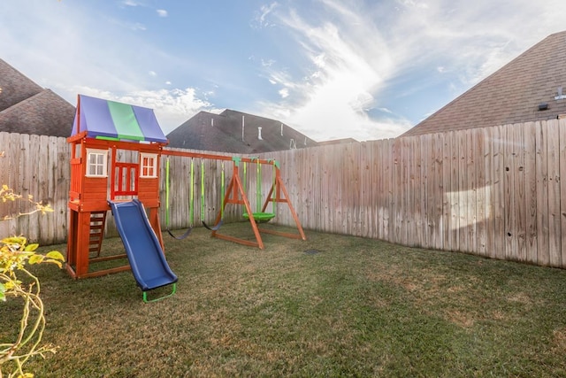 view of playground featuring a lawn