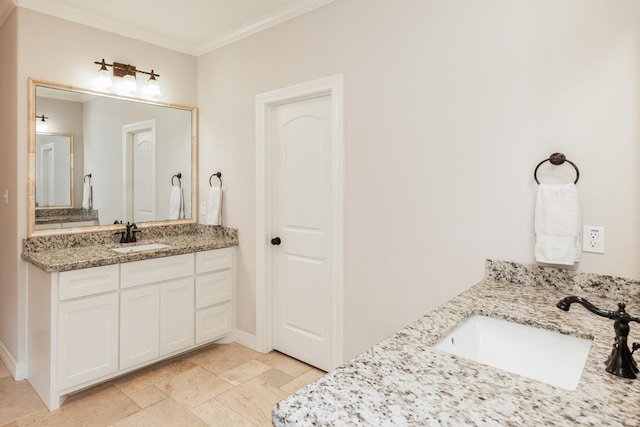 bathroom featuring vanity and crown molding