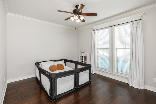 bedroom featuring ceiling fan, ornamental molding, and multiple windows