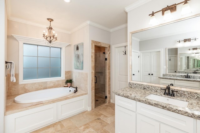 bathroom with vanity, ornamental molding, a chandelier, and plus walk in shower