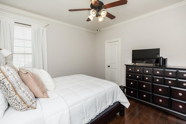 bedroom with ceiling fan and crown molding