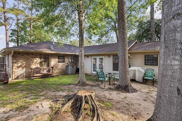 103 Read St, Silsbee, TX 77656 - rear view of property with french doors, roof with shingles, and a wooden deck