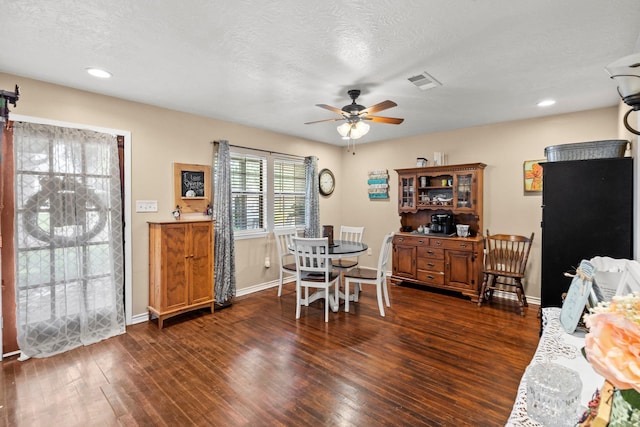 103 Read St, Silsbee, TX 77656 - dining area featuring a ceiling fan, dark wood-type flooring, a textured ceiling, and recessed lighting