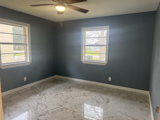 spare room featuring ceiling fan