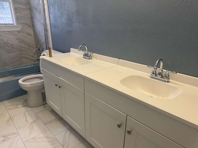 full bathroom featuring vanity, toilet, and tiled shower / bath combo