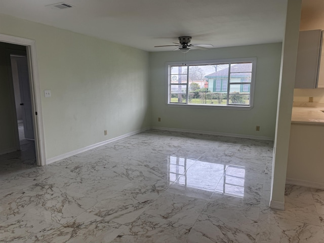 interior space with ceiling fan