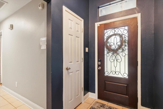 entryway featuring light tile patterned flooring