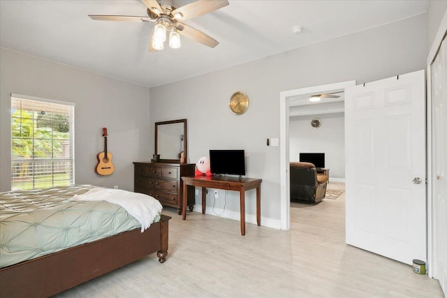 bedroom featuring ceiling fan and light wood-type flooring