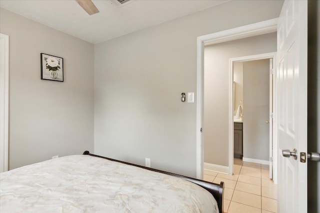 bedroom with ceiling fan and light tile patterned floors