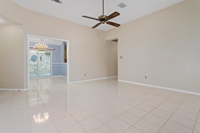 961 Green Mdw, Beaumont, TX 77706 - unfurnished room with light tile patterned floors, baseboards, visible vents, and ceiling fan with notable chandelier