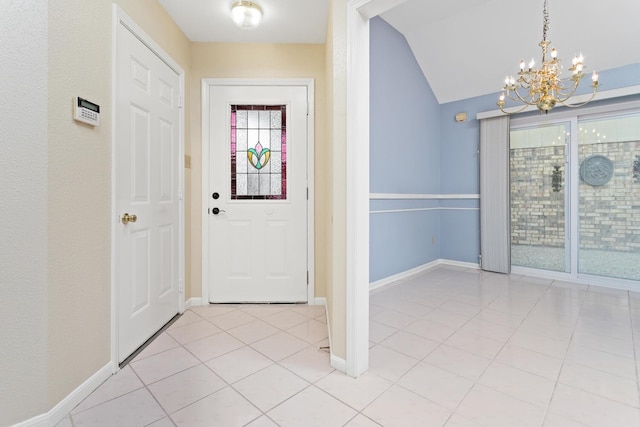 961 Green Mdw, Beaumont, TX 77706 - entryway with light tile patterned flooring, vaulted ceiling, baseboards, and an inviting chandelier