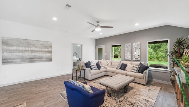 living room featuring visible vents, recessed lighting, baseboards, and wood finished floors