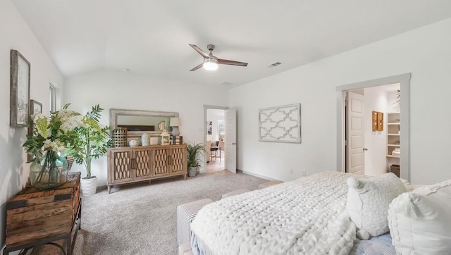 bedroom featuring visible vents, baseboards, lofted ceiling, light carpet, and a ceiling fan