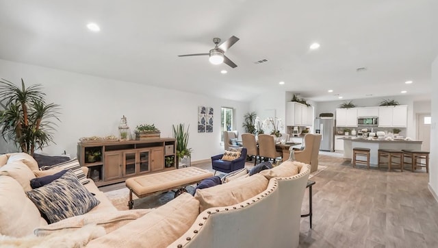 living area with visible vents, recessed lighting, light wood-style floors, and ceiling fan