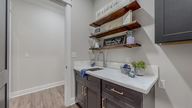 kitchen with sink and light wood-type flooring