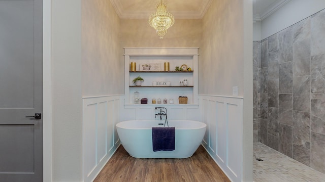 bathroom featuring crown molding, wood-type flooring, a notable chandelier, and plus walk in shower