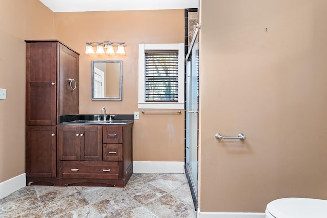 bathroom featuring walk in shower and vanity