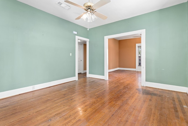 unfurnished room featuring hardwood / wood-style flooring and ceiling fan