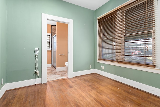 empty room featuring wood-type flooring