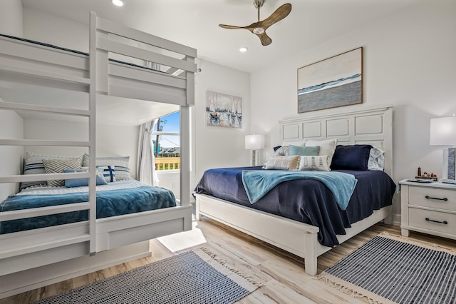 bedroom featuring ceiling fan and light hardwood / wood-style flooring