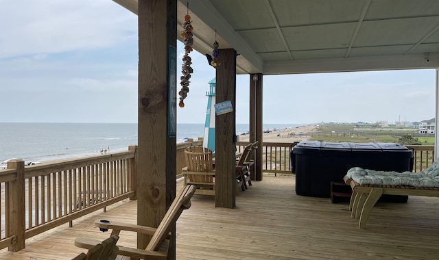 wooden deck featuring a water view