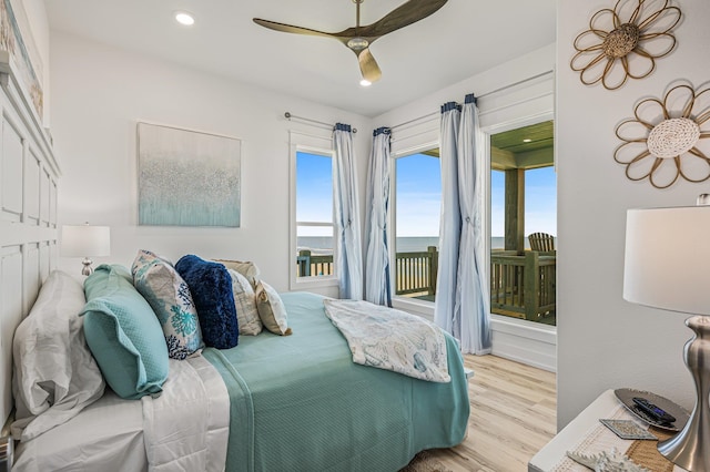 bedroom with ceiling fan and light wood-type flooring