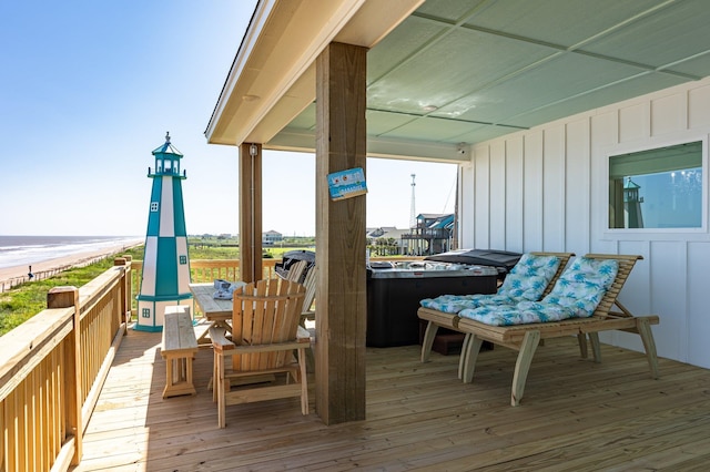 wooden deck featuring a hot tub