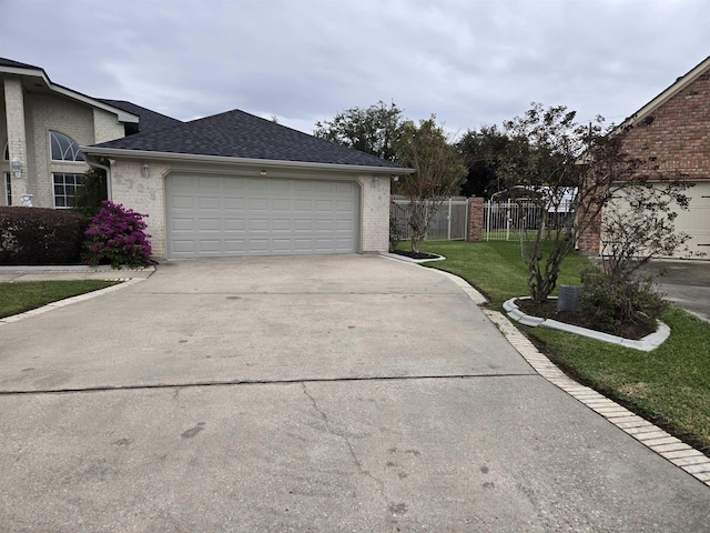 garage featuring a lawn