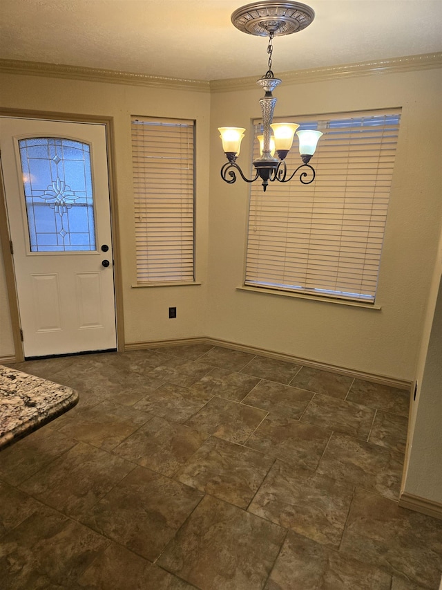 unfurnished dining area featuring ornamental molding and a chandelier