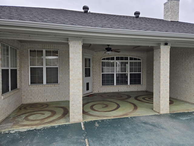 entrance to property with ceiling fan