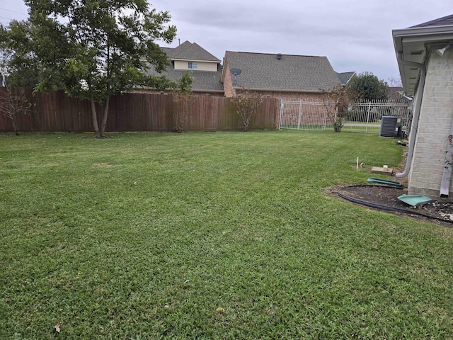 view of yard featuring central air condition unit