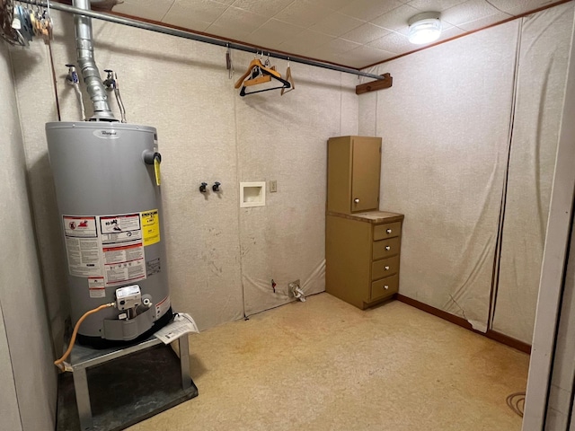 utility room featuring water heater