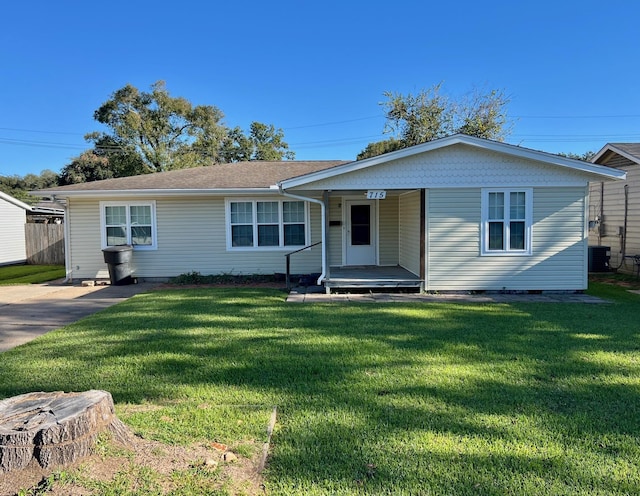 ranch-style home featuring central AC and a front lawn