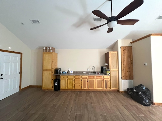 kitchen featuring dark hardwood / wood-style floors, ceiling fan, sink, and vaulted ceiling