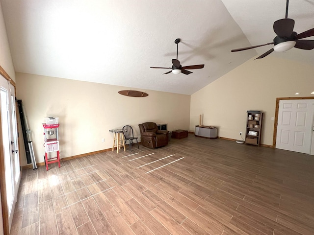 unfurnished room featuring ceiling fan, wood-type flooring, and lofted ceiling