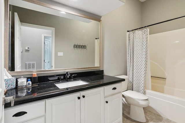 full bathroom featuring toilet, vanity, tile patterned flooring, and shower / bath combo with shower curtain