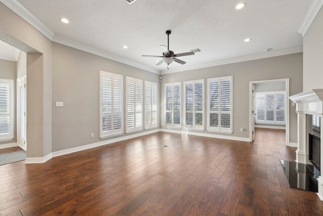 living room with ceiling fan, dark hardwood / wood-style floors, a high end fireplace, and crown molding