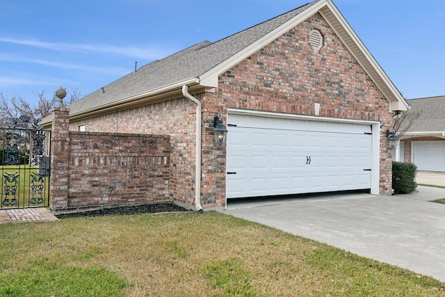 view of property exterior with a garage and a yard