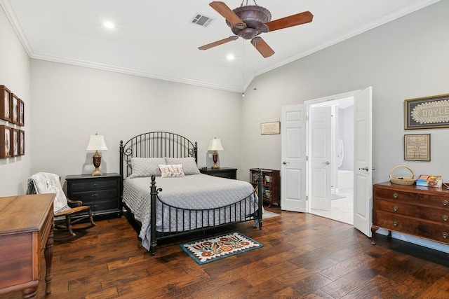 bedroom with vaulted ceiling, ceiling fan, crown molding, and dark hardwood / wood-style floors