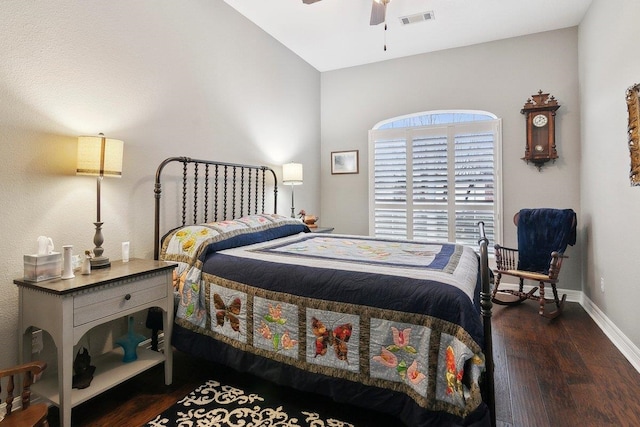 bedroom with ceiling fan and dark hardwood / wood-style floors