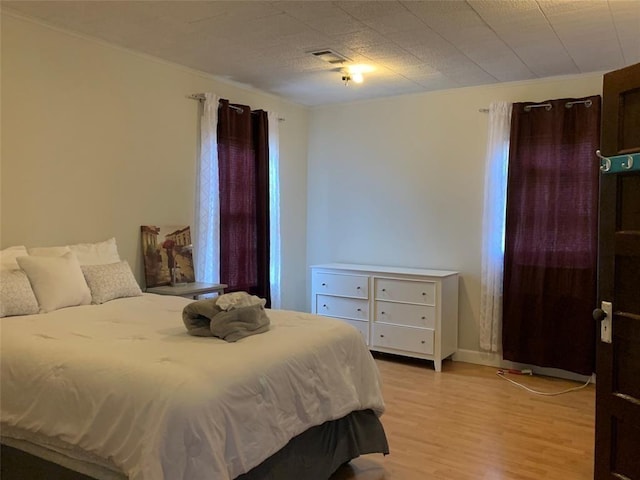 bedroom featuring light wood-type flooring