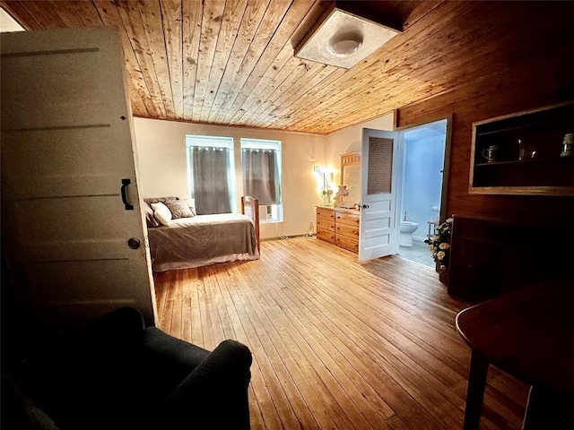 bedroom with hardwood / wood-style flooring and wood ceiling