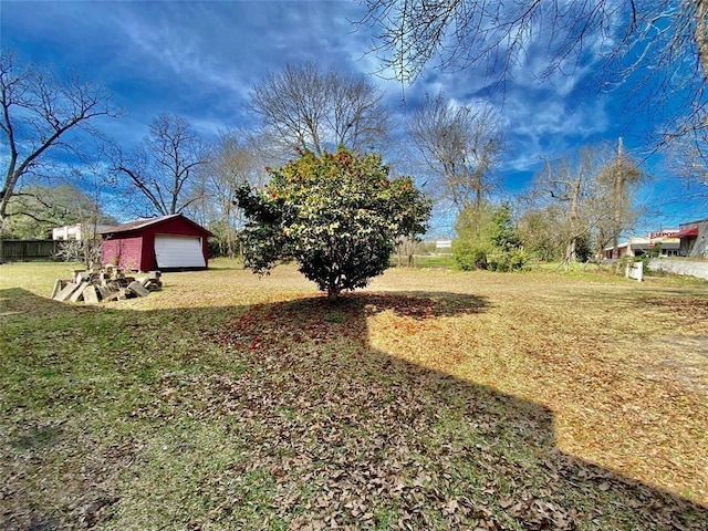 view of yard featuring an outbuilding and a garage