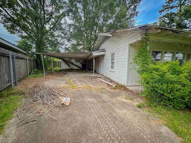 3 Inwood Cir Unit B, Orange, TX 77630 - view of home's exterior featuring concrete driveway and a carport