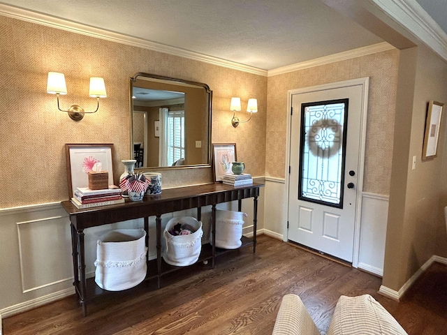 entrance foyer featuring dark hardwood / wood-style flooring and ornamental molding